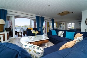 Living room opening onto large balcony