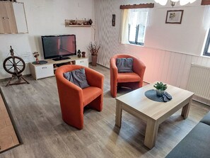 Furniture, Interior Design, Flooring, Floor, Wood, Room, Couch, Living Room, Table, Chair