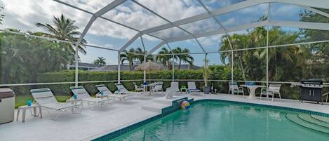 The spacious screened-in lanai is a perfect gather spot for friends and family (no hot tub included).