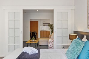 Bedroom with French doors leading to living room
