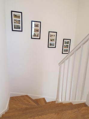 Original historic postcards decorate the staircase.