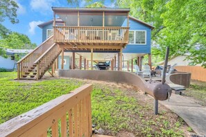 View of the back of the home and outdoor areas with propane grill!