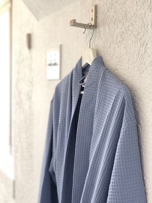 The rooms comes with his and hers robes.