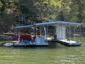 Covered boat slip plus 3 jet ski Drydocks. Swing, paddleboard  and 4 Kayaks