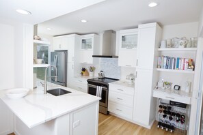 Chefs kitchen with coffee maker, microwave, toaster and propane grill