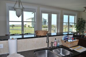 The kitchen allows you to look outside or to living area with unobstructed view.