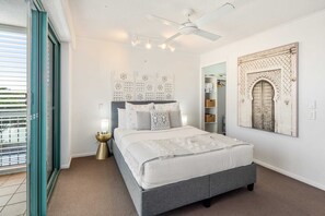 Master bedroom with small private balcony.
