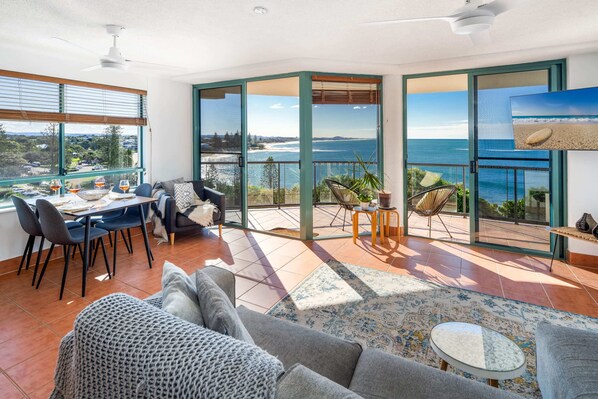 The incredible ocean views of Moffat Beach & beyond from the open plan living room.