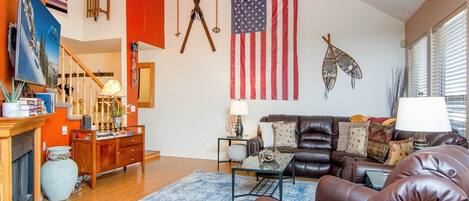 Open family room with vaulted ceiling and cozy ambiance