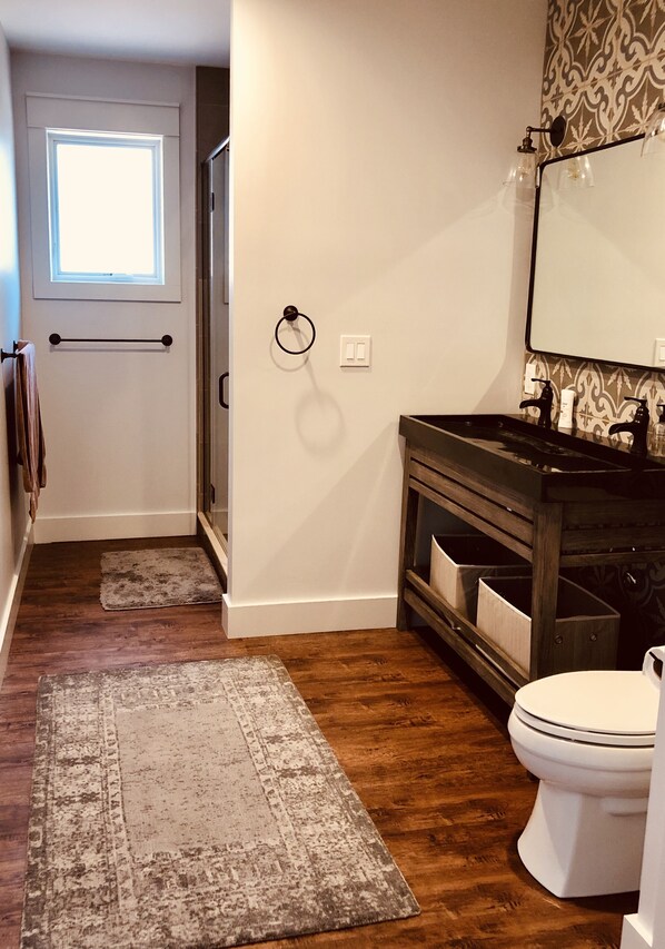 Bathroom with double sink and shower