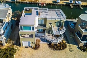 Over 2000 sq ft of rooftop, porches, and decking for 360 degree water views!