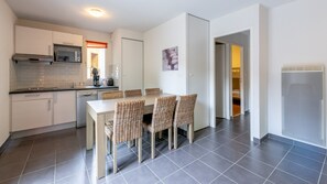 Prepare meals in the kitchenette and enjoy them at the dining table.