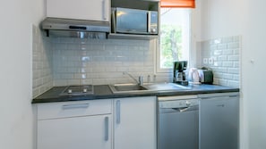 The kitchenette comes equipped for your convenience.