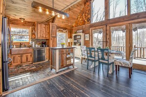 Look at the handcrafted logs above the china hutch!  Wow!