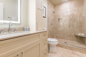 Ensuite Master Bathroom featuring a large frameless glass Italian marble shower. Enjoy the plush white towels, standard size blow dryer and complimentary travel size shampoo, conditioner, body wash, tooth brushes (2), tooth paste, mouth wash, lotion and makeup remover wipes (3).