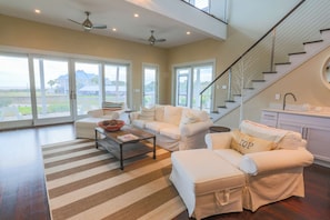 The home features ocean views from the screened porch, living room and kitchen areas.