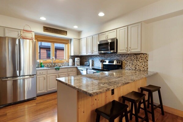 Kitchen with stainless steel appliances and granite countertops