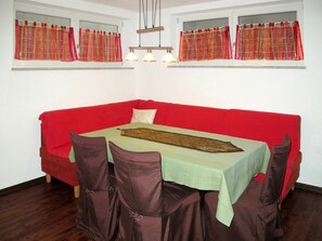 Room, Red, Furniture, Property, Interior Design, Tablecloth, Table, Window Covering, Window Treatment, Wall