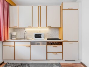 Building, Cabinetry, Countertop, Furniture, Property, Sink, Kitchen Stove, Drawer, Kitchen, Curtain
