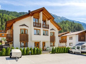 Cloud, Plant, Building, Sky, Property, Window, Mountain, Tree, Vehicle, House