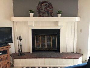 Beautiful fireplace is the centerpiece of the living room. 