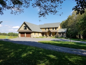 Park to the left of the Garage. The door to the Board Room is in the rear.