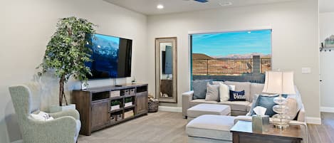 The HEART of this beautiful home is this comfy and relaxing family room. 75" TV