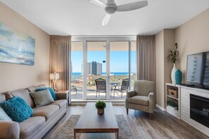 Living room view with Balcony and Fireplace