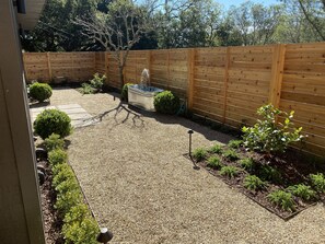 Newly landscaped yard with fountain and lighting