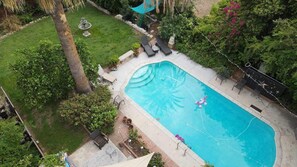 Aerial view of pool and back lawn area.