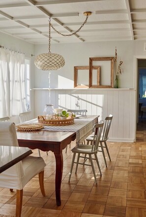 Large dinning table next kitchen and living area