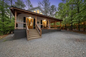 Nestled in a secluded cul de sac and surrounded by towering pines and forest.