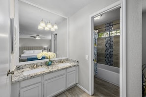 Ooh, look-two sinks! Private shower and commode. Spacious enough for a couple.