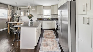Chefs kitchen with gas stove and island. Fully stocked with all the necessary cookware and utensils. Also complimentary coffee, with sugar and creamer. French press plus drip coffee machine.