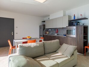 Furniture, Couch, Cabinetry, Interior Design, Studio Couch, Table, Living Room, Flooring, Shelf