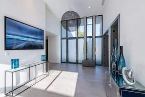 Stunning and bright front entrance area with 14 foot ceilings
