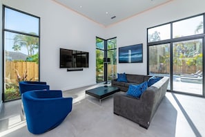 Bright, living room area with ample seating for friends and family