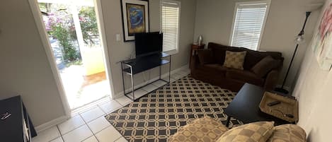 Front entray to living room tv sofa sofa bed