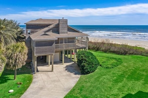 Swaying palm trees, emerald green grass, and the Gulf of Mexico in your backyard