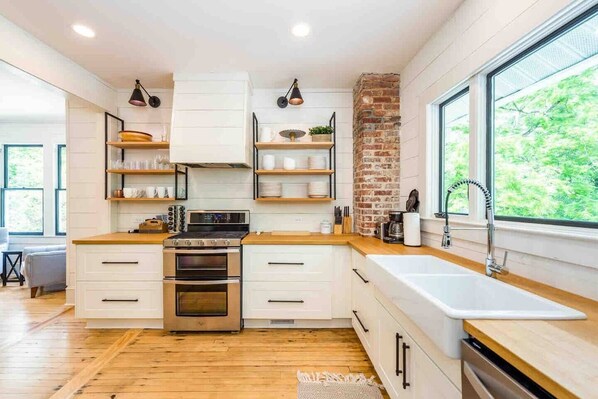 Large open kitchen fully stocked for all your cooking needs.  