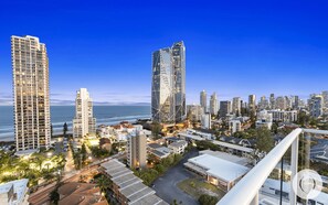 Balcony features glittering ocean and city views