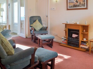 Living room and adjacent sun room | White Gables - Scott Holiday Cottages, Portknockie