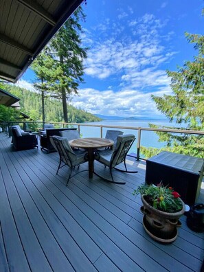 Relax on the spacious deck, complete with cozy seating, perfect for soaking in breathtaking bay vistas.