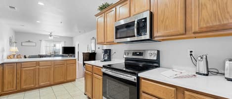 Kitchen equipped with full size Appliances.