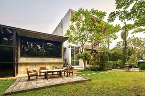 Terrace in the garden with wooden coffee table set