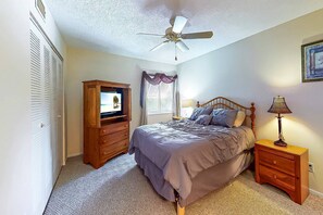 Master Queen bedroom with TV and ensuite bath.