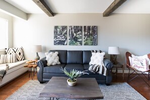 High end design and decor on the comfy couch!  Also is a queen sleeper sofa!