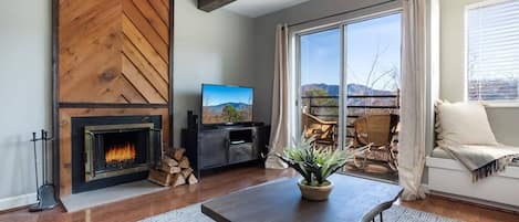 Incredible first floor condo with awesome views of Mt. LeConte and The Great Smoky Mountains National Park!  Wood burning fireplace!
