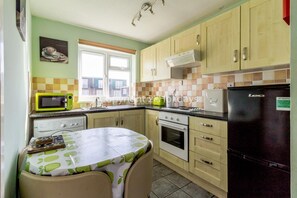 Kitchen is perfected for self catering breaks with a full size cooker!