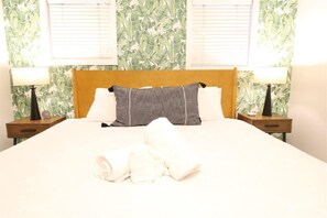 Comfy king sized bed awaits weary travelers 